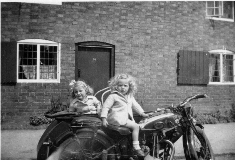 File:P02-Lawrence (with long hair) and Veronica in sidecar on their Dads motorbike outside No16.jpg